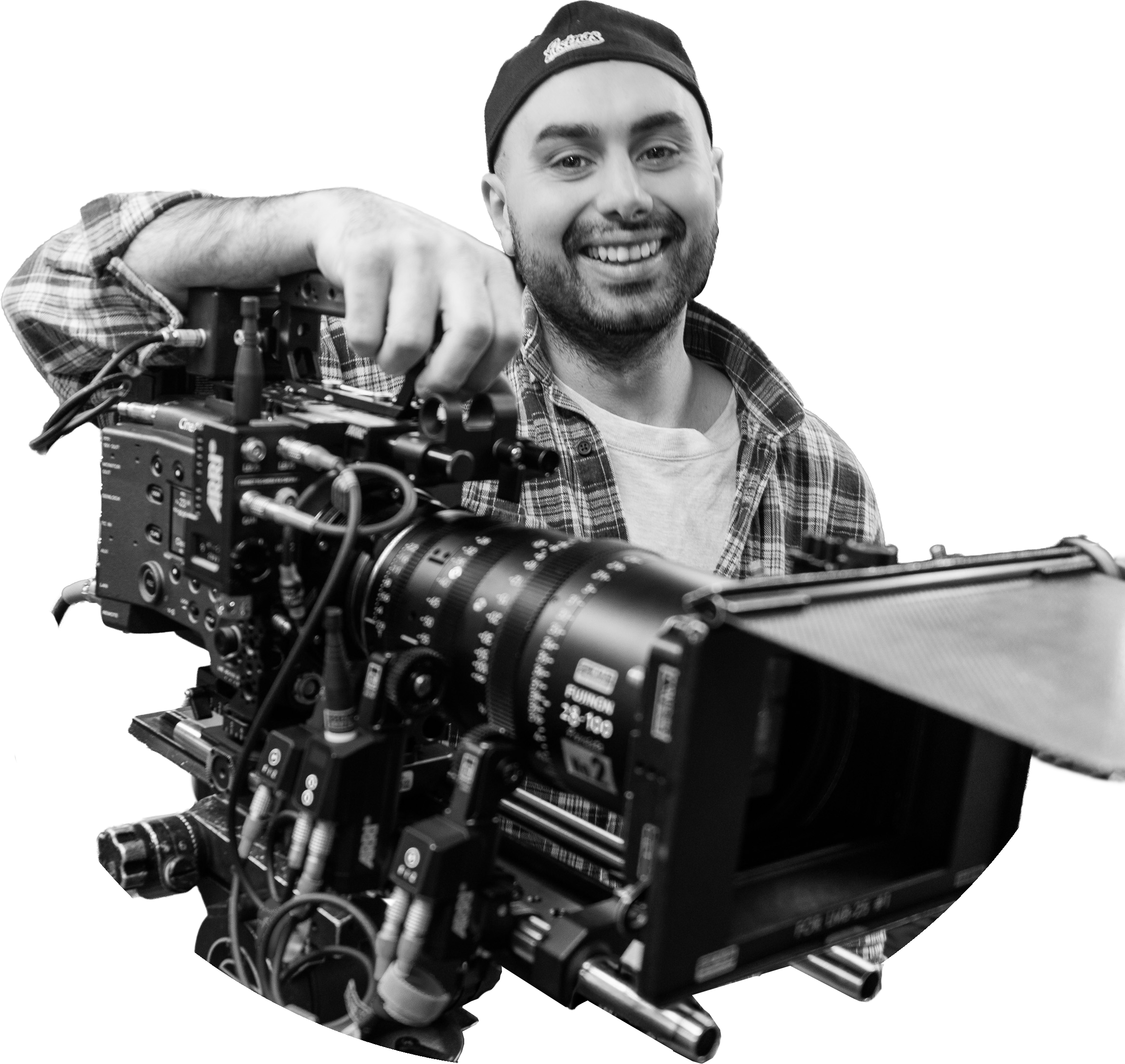 Sina Engin operating a cinema camera on set